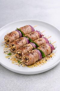 Involtini di Vitello alla Siciliana con Pinoli, Uvetta e Pecorino